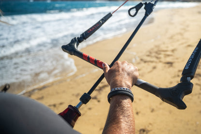 Rider holding the North Navigator 2027 bar on the beach
